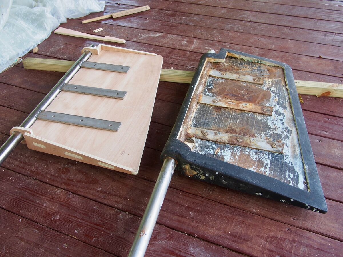 A newly rebuilt rudder beside the old one