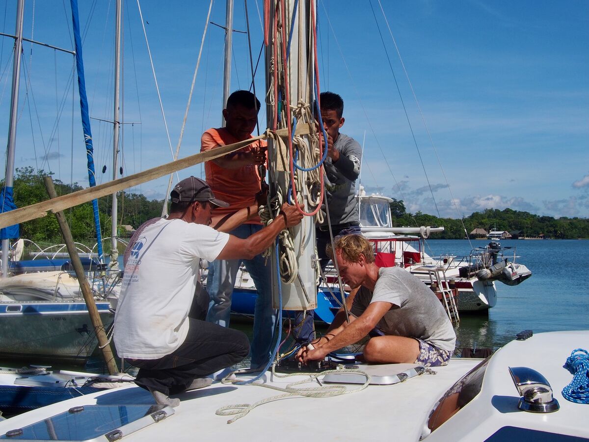 Working on the rigging at the mast